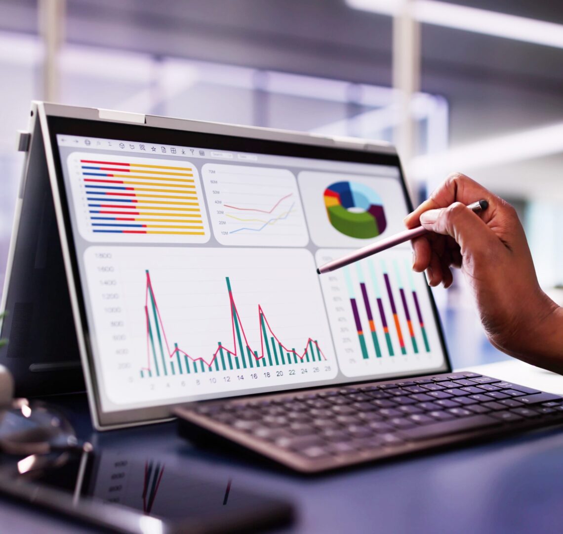 African,American,Woman,Analyzing,Financial,Data,On,Laptop,Screen,In