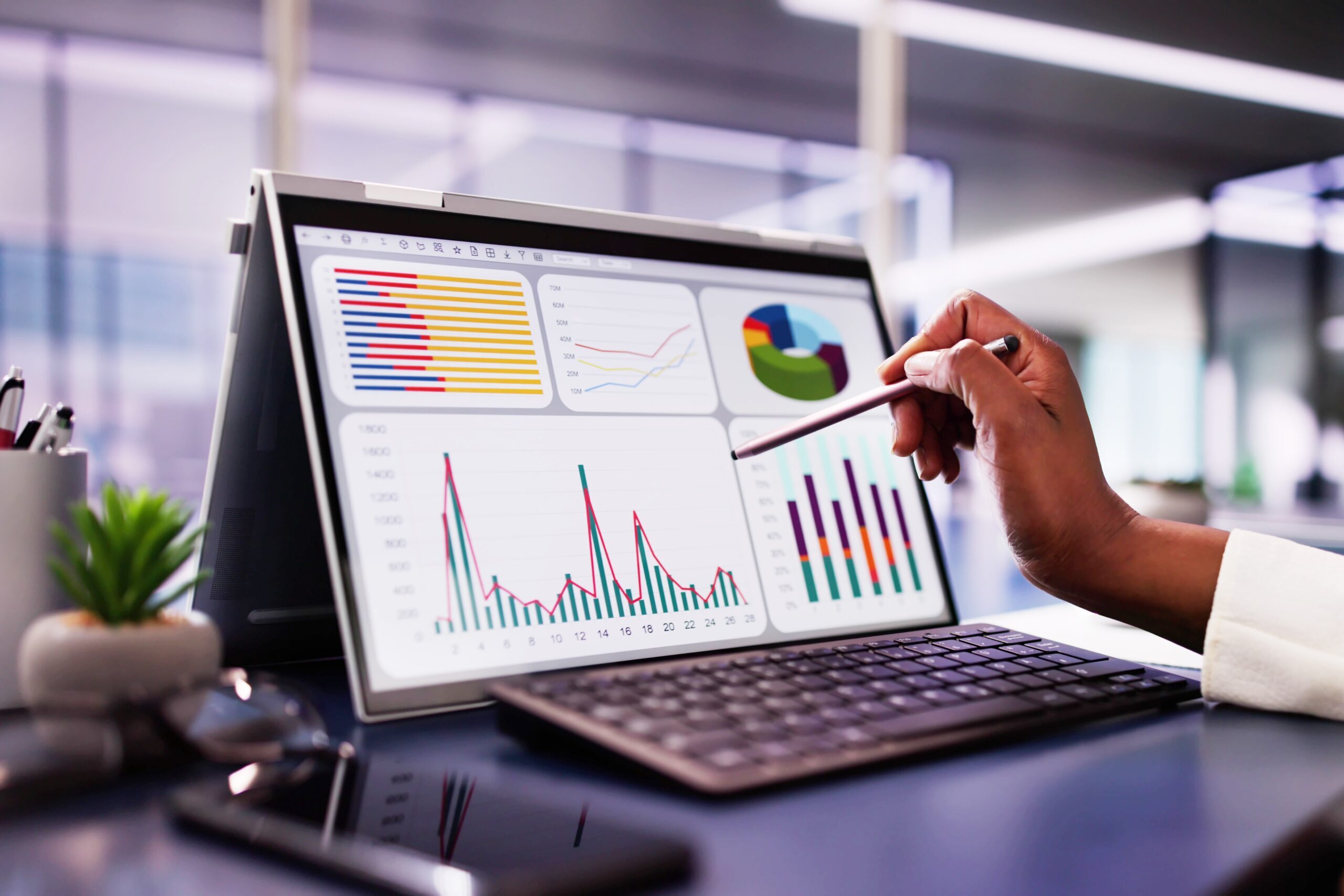 African,American,Woman,Analyzing,Financial,Data,On,Laptop,Screen,In