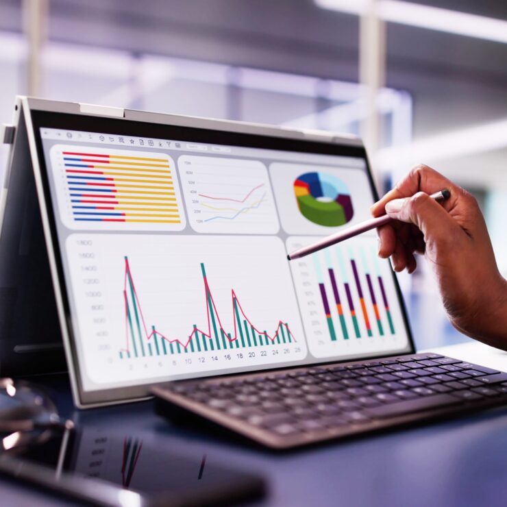 African,American,Woman,Analyzing,Financial,Data,On,Laptop,Screen,In